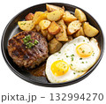fried egg and fried potatoes on a black plate 132994270