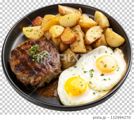 fried egg and fried potatoes on a black plate 132994270