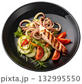 grilled squid garnished with vegetables 132995550