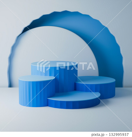 a static display of four blue cylindrical podiums and a large curved backdrop. 132995937