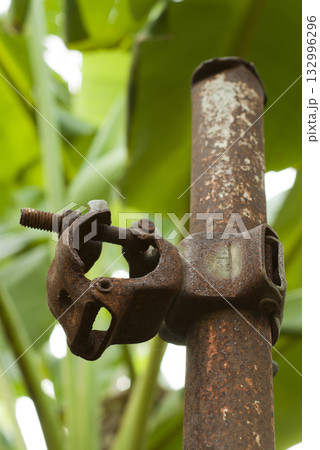 The Old Pressed Clamp of Scaffolds on the pipe 132996296