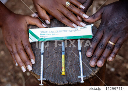 Needle medicinal pregnancy maternity baby bump couple hands details Needle medicinal pregnancy maternity baby bump couple hands details 132997314