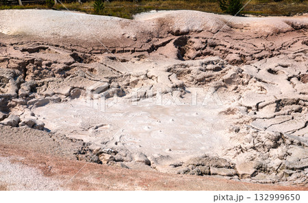 Close-up view of the bubbling, steaming mud at Fountain Paint Pot in Yellowstone National Park. The geothermal feature creates patterns in the thick, pinkish-gray mud Close-up view of the bubbling, steaming mud at Fountain Paint Pot in Yellowstone National Park. The geothermal feature creates patterns in the thick, pinkish-gray mud 132999650