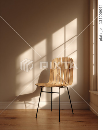 A minimalist wooden chair set against a vertical slatted screen, creating strong shadows in a monochromatic beige space. 133000044