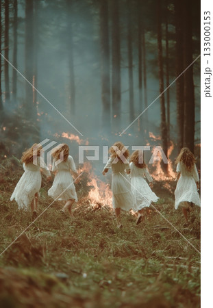 Women in White Dresses Dance Around a Large Fire in a Dark Forest at Night Details matter. 133000153