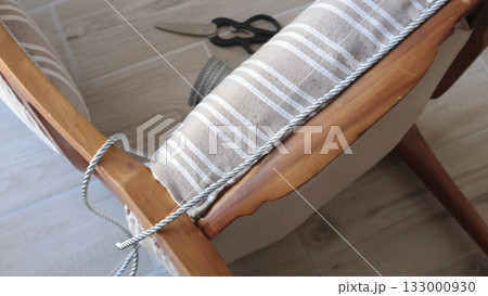 Anonymous person glues decorative braid. Antique furniture restoration. Crafts and hobbies. 133000930