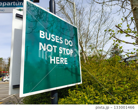 Buses Do Not Stop Here sign on roadside, public transit notice Buses Do Not Stop Here sign on roadside, public transit notice 133001466