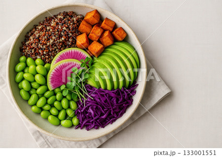 Colorful Vegan Nourish Bowl with Avocado, Quinoa, and Edamame 133001551