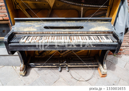 old piano on street in Tbilisi city 133001655