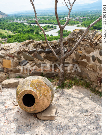amphora (kvevri) for wine and view of Kura river 133001951
