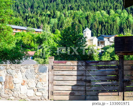 cityscape of Mestia town with church in summer 133001971