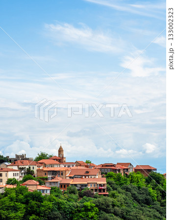 white clouds in blue sky over Sighnaghi town white clouds in blue sky over Sighnaghi town 133002323