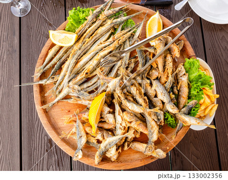 plate with various fried local black sea fishes 133002356