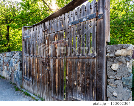 old wooden gates on street in Mestia town, Georgia 133002364
