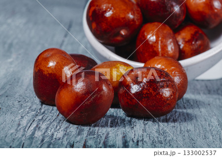 jujube fruits on a gray wooden table 133002537