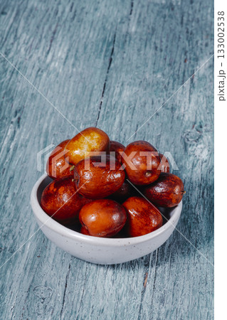 jujube fruits in a ceramic bowl 133002538