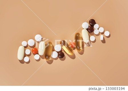 Pills, capsules, and tablets arranging in medical concept 133003194