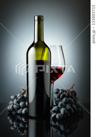 Red wine and juicy blue grapes. 133003715