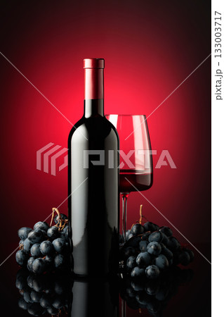 Red wine and juicy blue grapes. 133003717