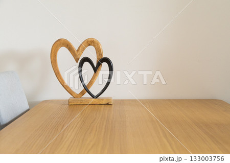 Wooden hearts on table. Love, connection, and gentle warmth of shared life and emotional closeness. Copy space Wooden hearts on table. Love, connection, and gentle warmth of shared life and emotional closeness. Copy space 133003756