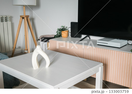 Ceramic vase on modern table. Minimalism, interior design, and quiet balance between function and beauty. 133003759