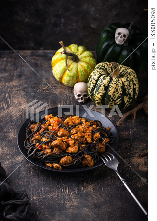 Halloween dish black pasta with bolognese 133005098
