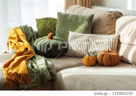 Autumn Sofa Styling with Textured Pillows, Fabric Pumpkins, and Cozy Blankets 133005250