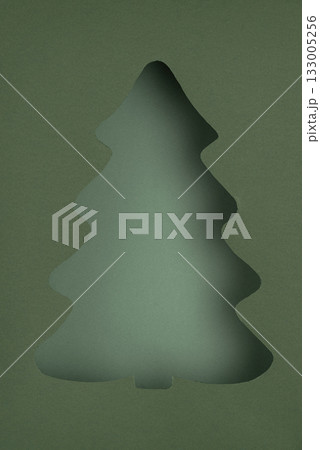 Stylized Christmas Tree Cutout on Layered Green Paper Stylized Christmas Tree Cutout on Layered Green Paper 133005256