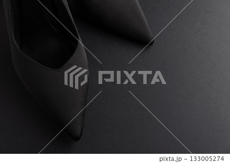 Black Friday Fashion: Elegant Black Shoes with Bows on Black Background Black Friday Fashion: Elegant Black Shoes with Bows on Black Background 133005274