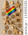 Festive Christmas Pride Flat Lay with Rainbow Ornaments, Pinecones, and Candles 133005285