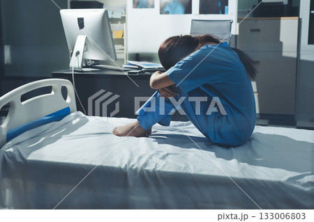 A patient with depression looks outside. A patient with depression looks outside. 133006803