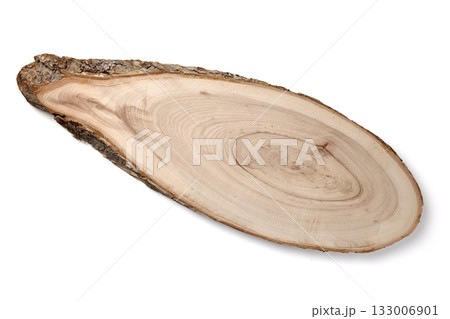 Cutting board made of wood cut with bark isolated on white background top view. Cutting board made of wood cut with bark isolated on white background top view. 133006901