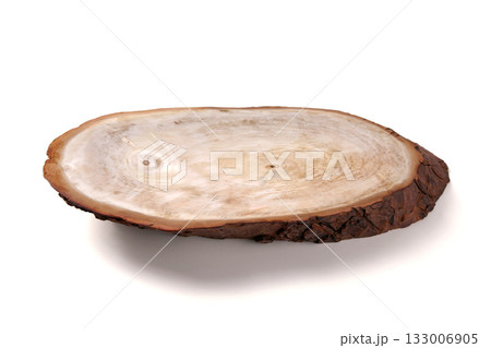 Wooden plate of oblong shape made from a tree cut isolated on white background. 133006905