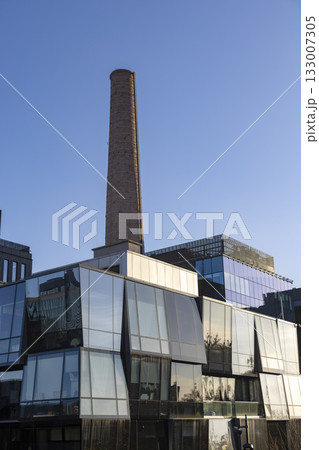 A business center with original glass architecture and industrial elements such as a pipe 133007305