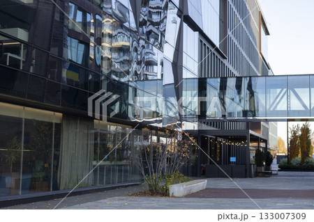 A modern business center with a glass facade and contemporary architecture A modern business center with a glass facade and contemporary architecture 133007309