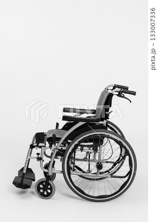 A Modern Wheelchair on a Minimalist Background, Highlighting Style and Functionality A Modern Wheelchair on a Minimalist Background, Highlighting Style and Functionality 133007336