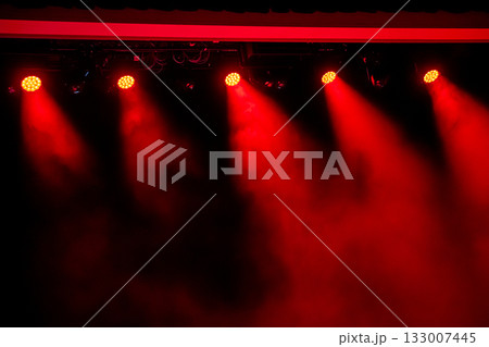 Enhancing Dynamic Red Stage Lighting with an Added Smoke Effect for Maximum Impact and Atmosphere Enhancing Dynamic Red Stage Lighting with an Added Smoke Effect for Maximum Impact and Atmosphere 133007445