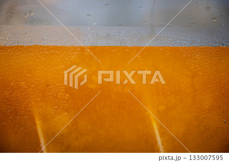 A Refreshing Cold Beverage Served in a Clear Glass Perfect for Enjoying on a Hot Day 133007595
