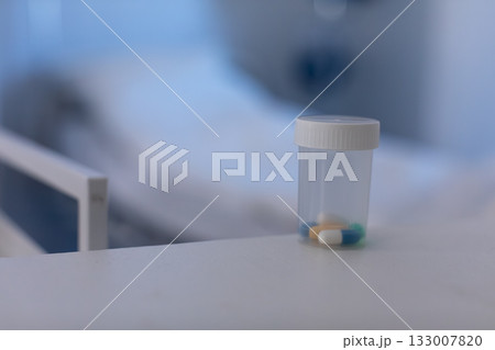 A closeup view featuring multiple prescription medication bottles positioned neatly on a table A closeup view featuring multiple prescription medication bottles positioned neatly on a table 133007820