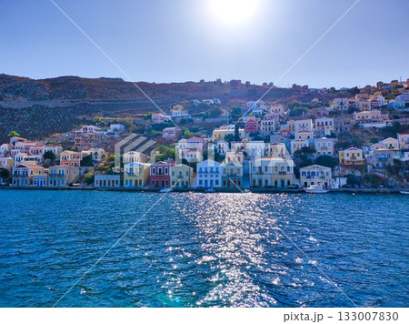 Vibrant Coastal Homes Positioned Beautifully Against a Glittering and Sparkling Sea Horizon Vibrant Coastal Homes Positioned Beautifully Against a Glittering and Sparkling Sea Horizon 133007830