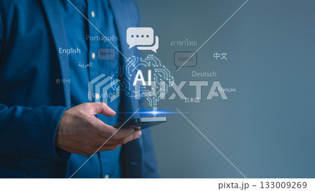 Man holding smartphone with glowing AI icon and multiple world languages, representing artificial intelligence translation, global communication, multilingual technology, and digital innovation. 133009269