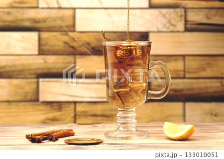Cup of Cinnamon Lemon Tea on Wooden Table. High quality photo Cup of Cinnamon Lemon Tea on Wooden Table. High quality photo 133010051