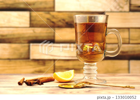 Cup of Cinnamon Lemon Tea on Wooden Table. High quality photo Cup of Cinnamon Lemon Tea on Wooden Table. High quality photo 133010052