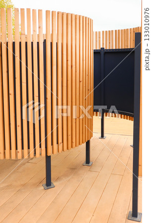 Beach changing cabin with wooden slats modern pavilion vertical composition 133010976
