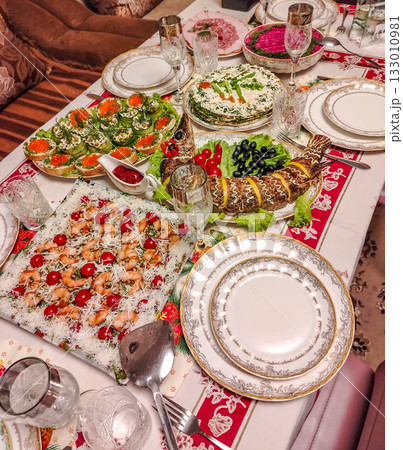 Festive home dinner table with caviar and shrimp elegant table setting vertical frame 133010981