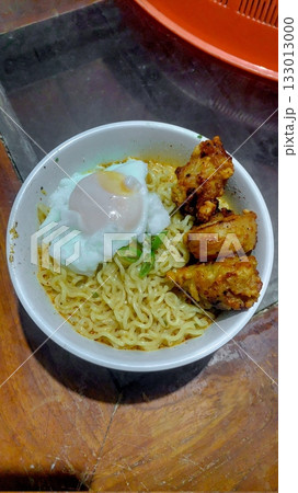 Delicious Indomie kuah with rich, savory broth and springy noodles, creating a warm and comforting meal. Perfect for a quick, satisfying dish with bold flavors and aromatic spices! 133013000