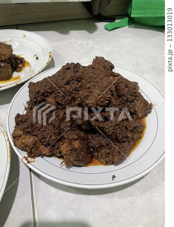 Rich and tender rendang with slow-cooked beef in spiced coconut gravy, offering a perfect blend of bold, aromatic flavors and melt-in-your-mouth texture in every authentic Indonesian bite. Rich and tender rendang with slow-cooked beef in spiced coconut gravy, offering a perfect blend of bold, aromatic flavors and melt-in-your-mouth texture in every authentic Indonesian bite. 133013019