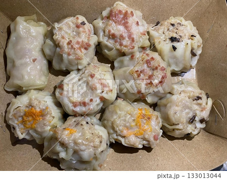 Shumai shrimp with sauce, Steamed shrimp dumplings dim or dim sum and vegetable on wooden table, Cantonese Dimsum food cuisine for breakfast, Chinese traditional food. 133013044