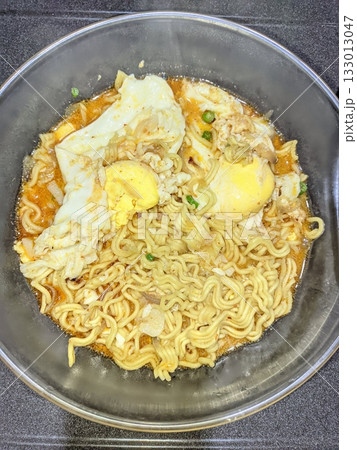 Delicious Indomie kuah with rich, savory broth and springy noodles, creating a warm and comforting meal. Perfect for a quick, satisfying dish with bold flavors and aromatic spices! Delicious Indomie kuah with rich, savory broth and springy noodles, creating a warm and comforting meal. Perfect for a quick, satisfying dish with bold flavors and aromatic spices! 133013047