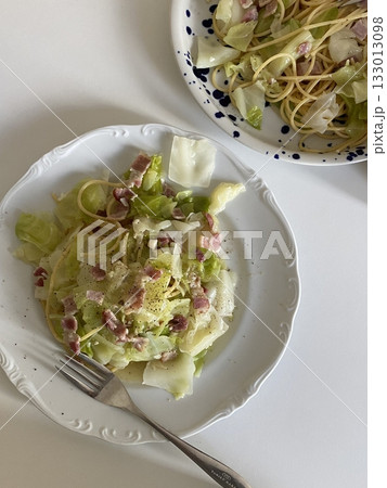 Spaghetti salad combines al dente pasta with fresh vegetables, tangy dressing, and optional herbs or cheese. A vibrant, refreshing dish perfect for light meals or gatherings. 133013098